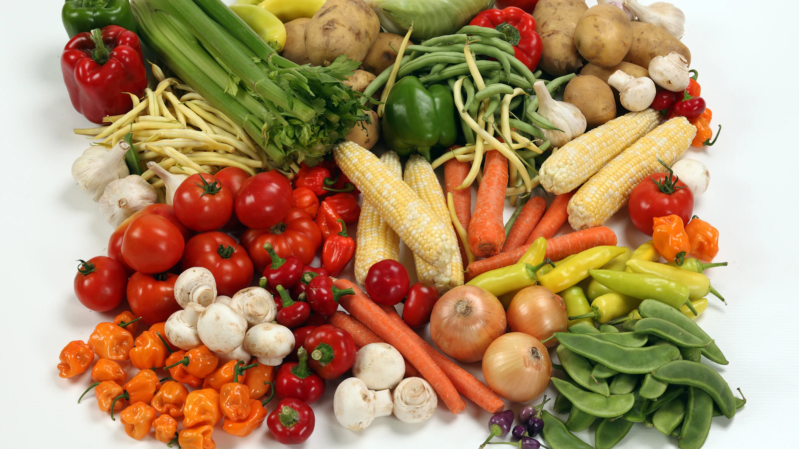 An assortment of fresh vegetables on a table.